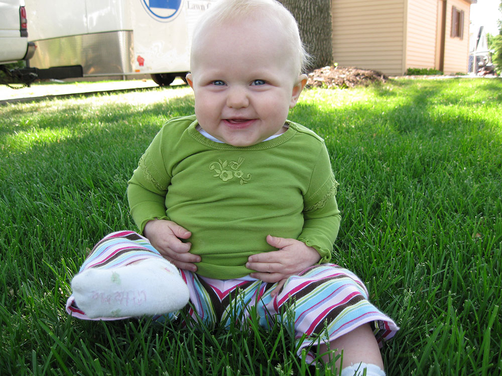 Baby sitting on grass